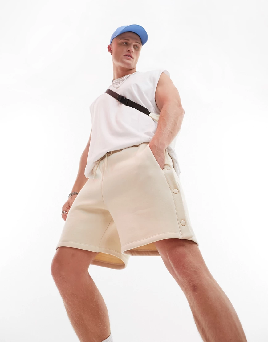 ASOS DESIGN oversized jersey shorts with poppers in beige-Neutral