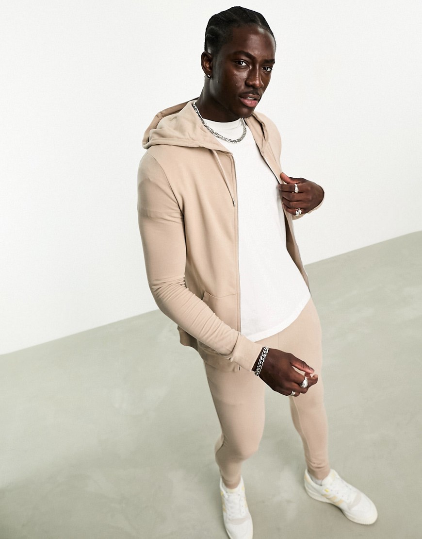 ASOS DESIGN muscle fit zip through hoodie with super skinny joggers tracksuit in beige-Neutral