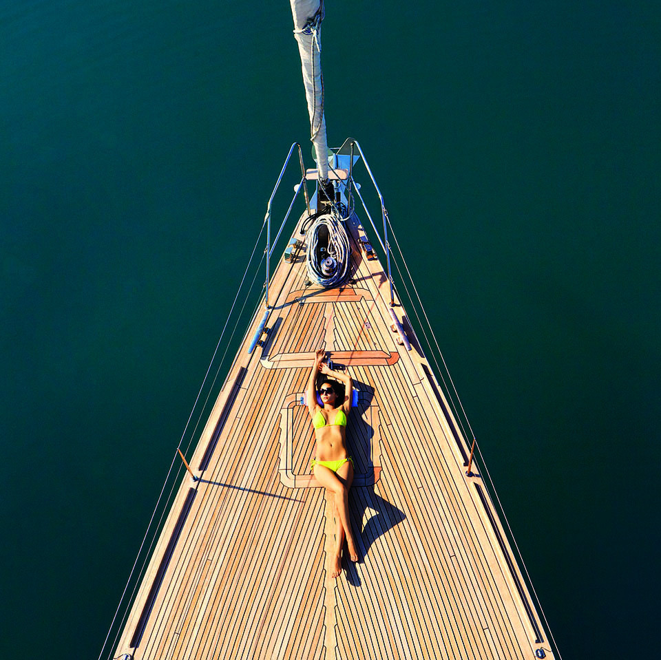 A guest lounges on a luxury yacht at Porto Montenegro.