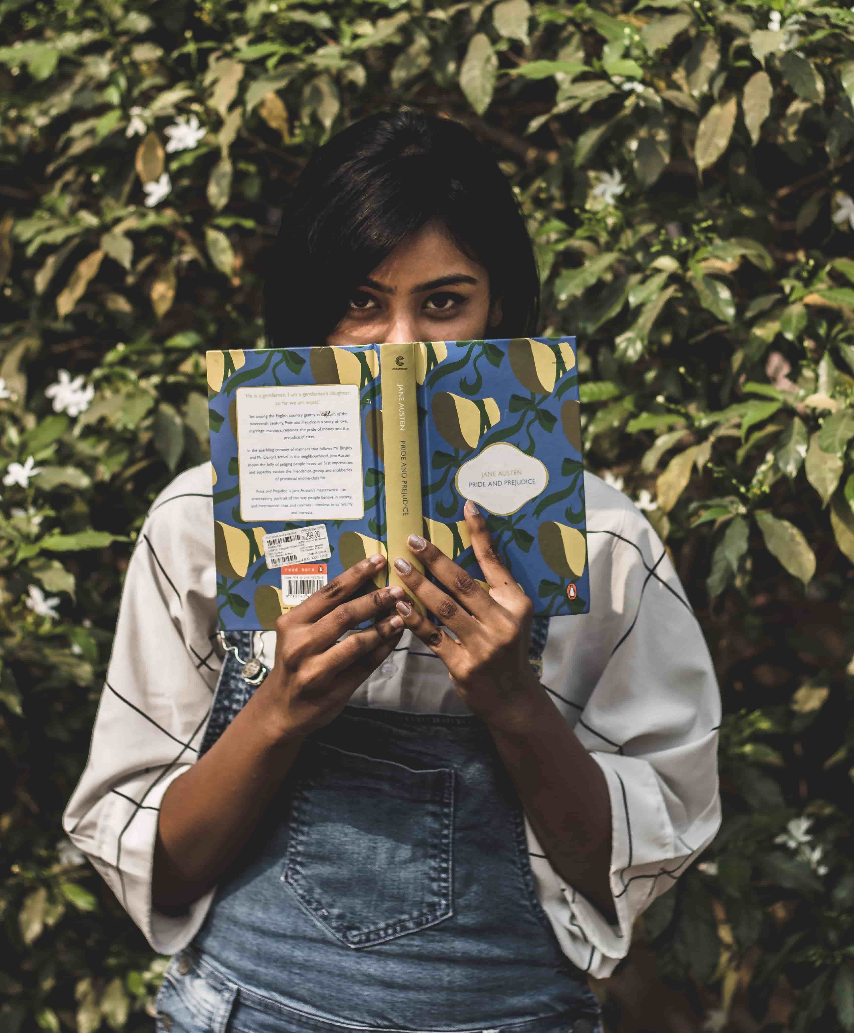 A girl holding Jane Austen book in her hand