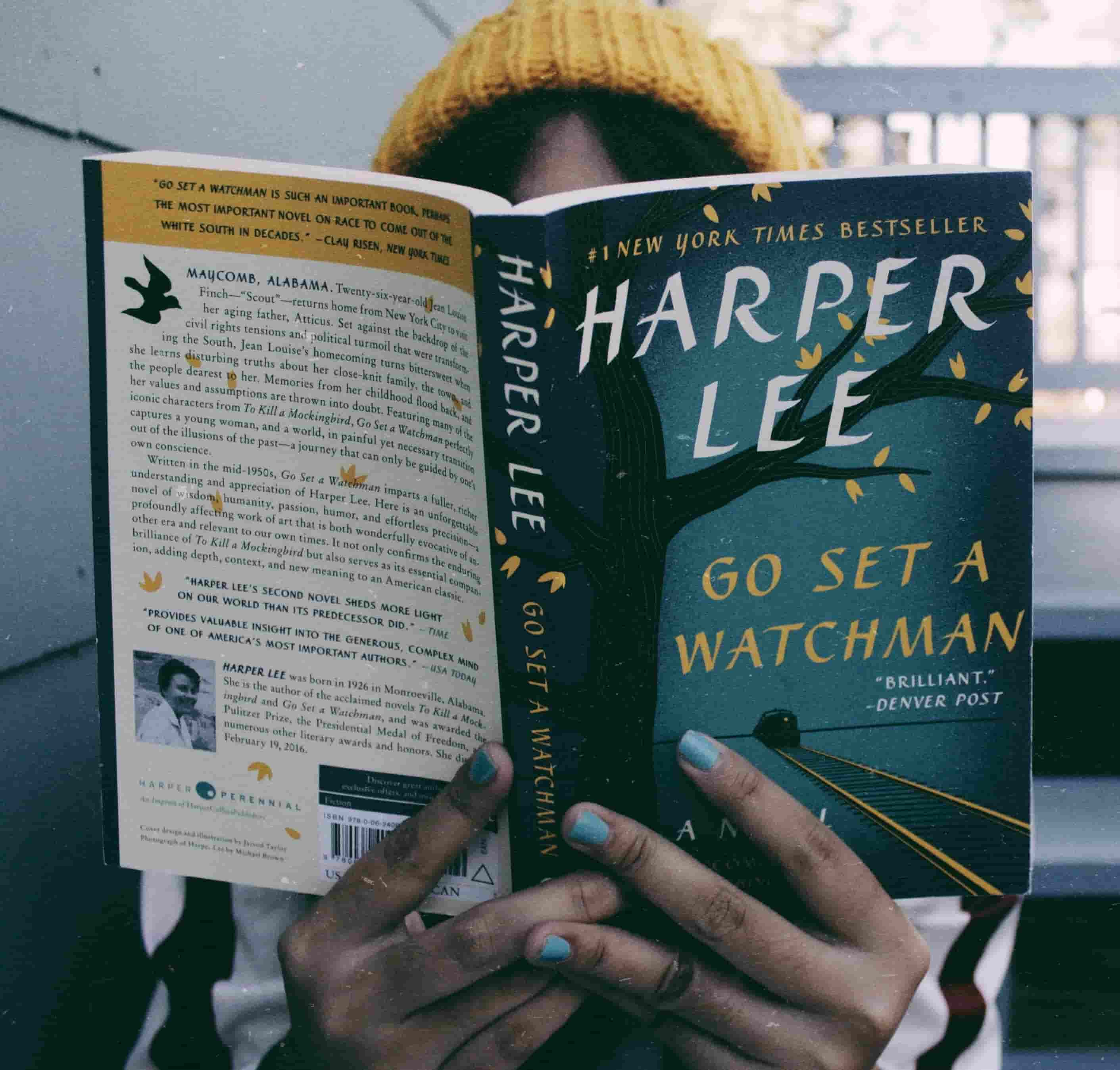 Girl holding Go Set a Watchman book