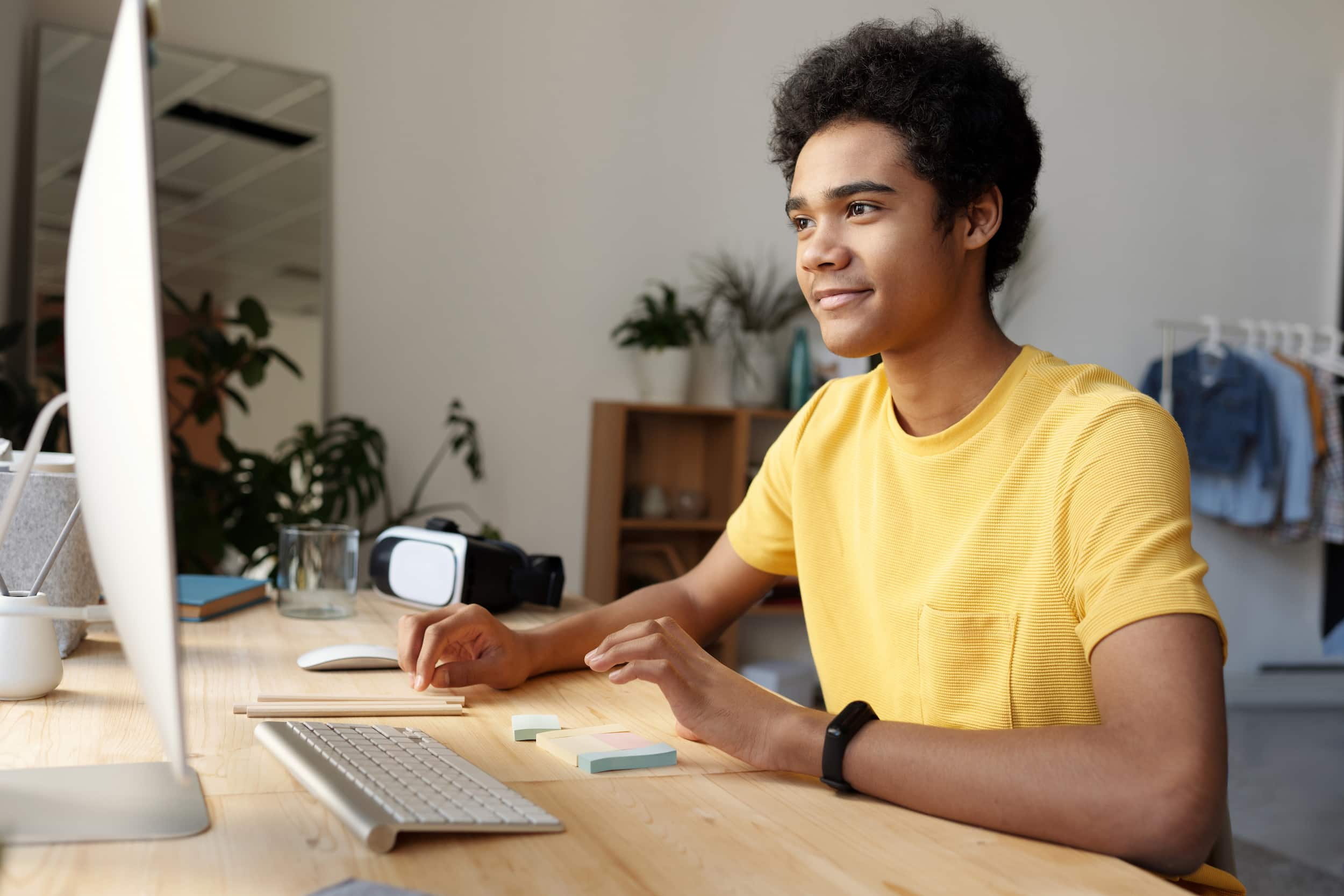 Student using computer with smile to attend online class