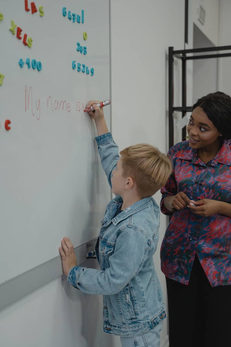 teacher helping student to write in english