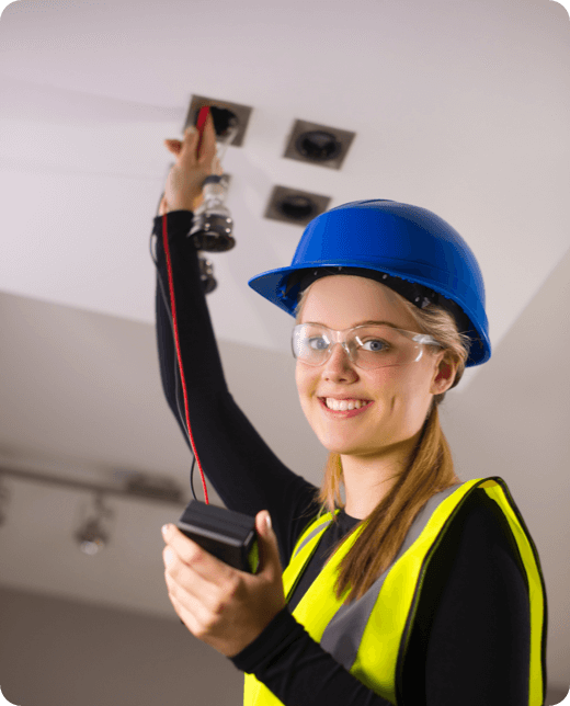 a young woman fixing ceiling lights