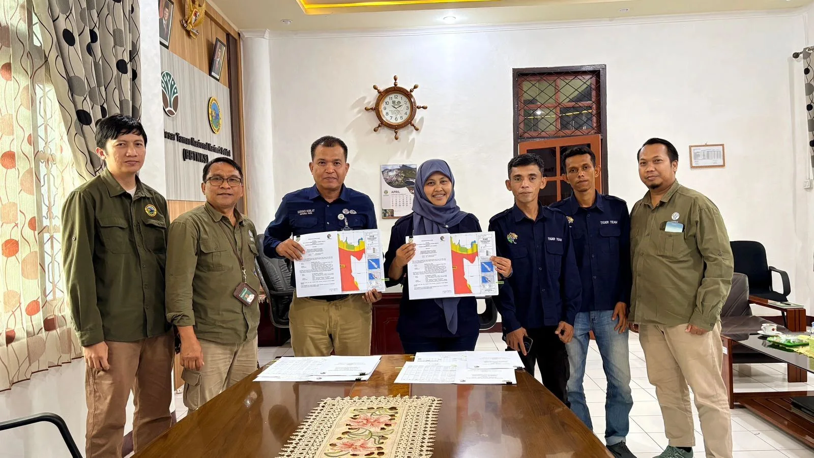 The Hutan Harimau team with staff of Kerinci Seblat National Park in the park's office