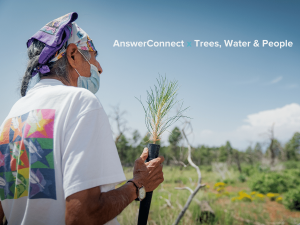 Man holding tree that will be planted