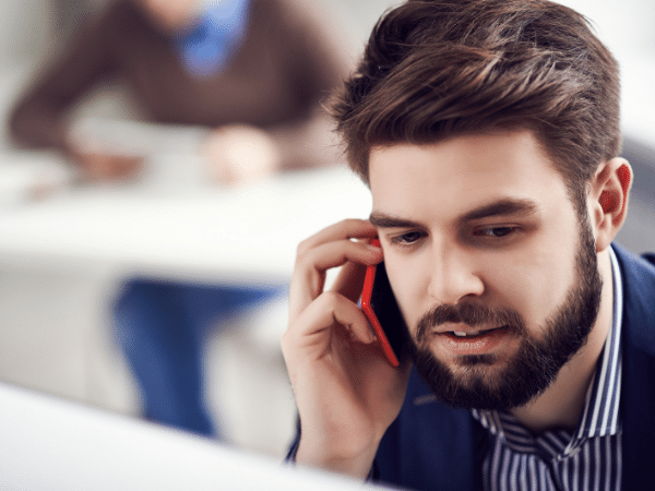 man talking on the phone in an office