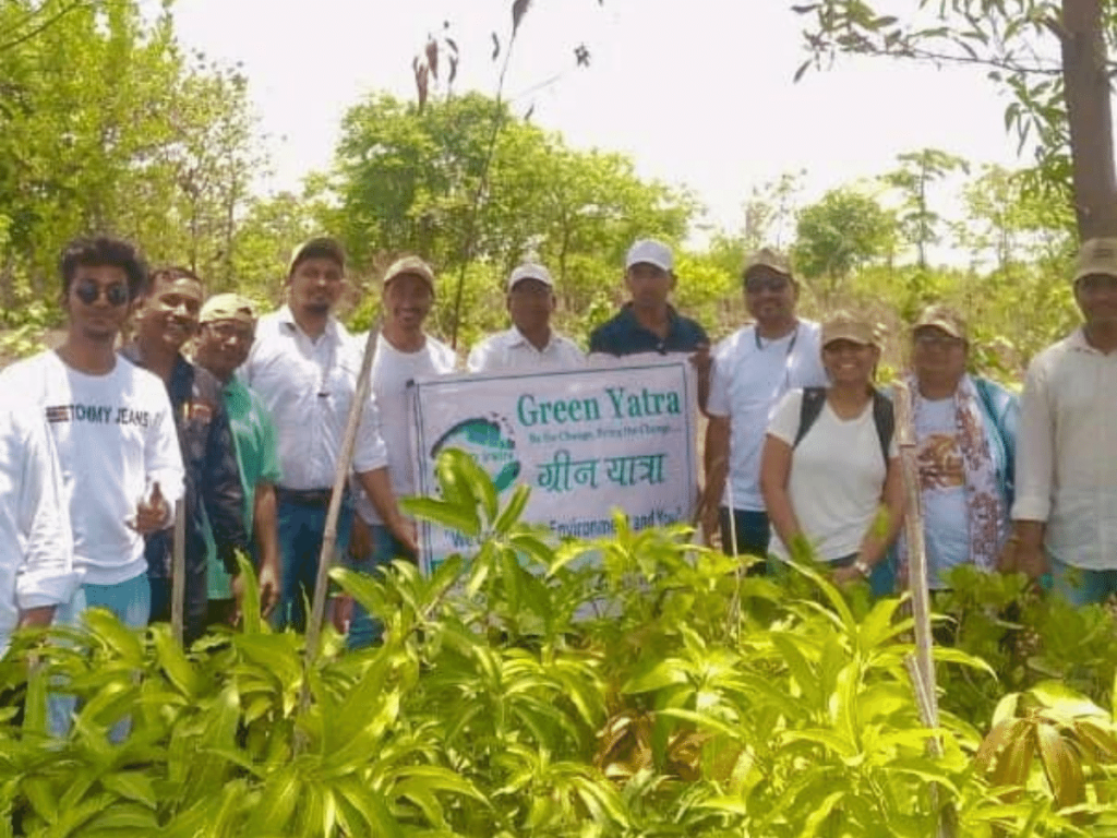 members of Green Yatra team standing within forest