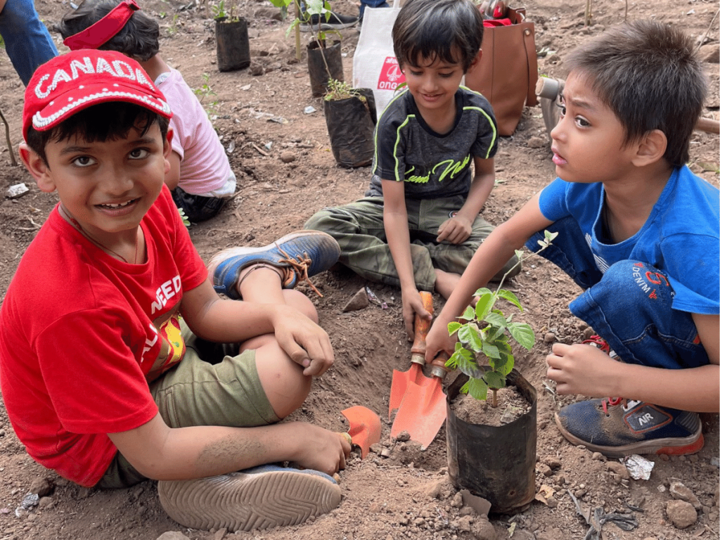 Children planting trees together