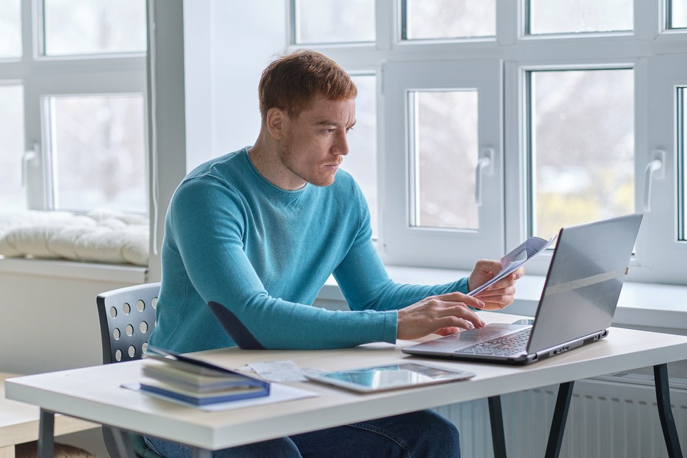 Business man at laptop entering lead capture details