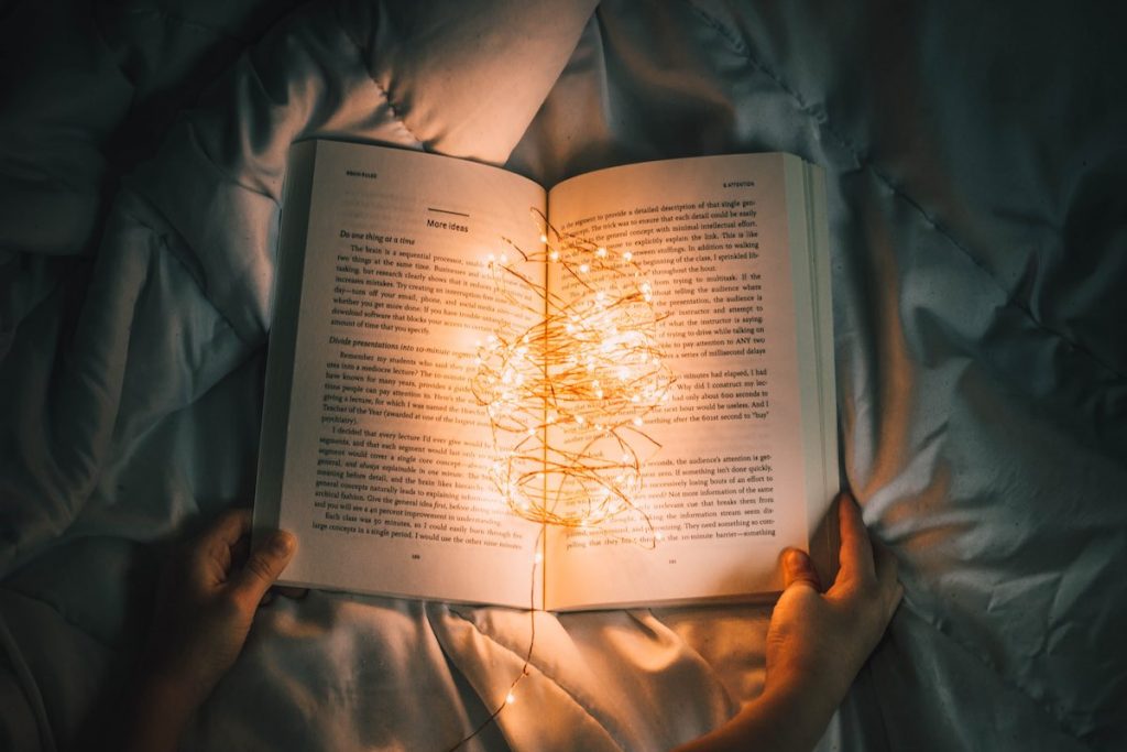 Photos of lights in a book representing storytelling