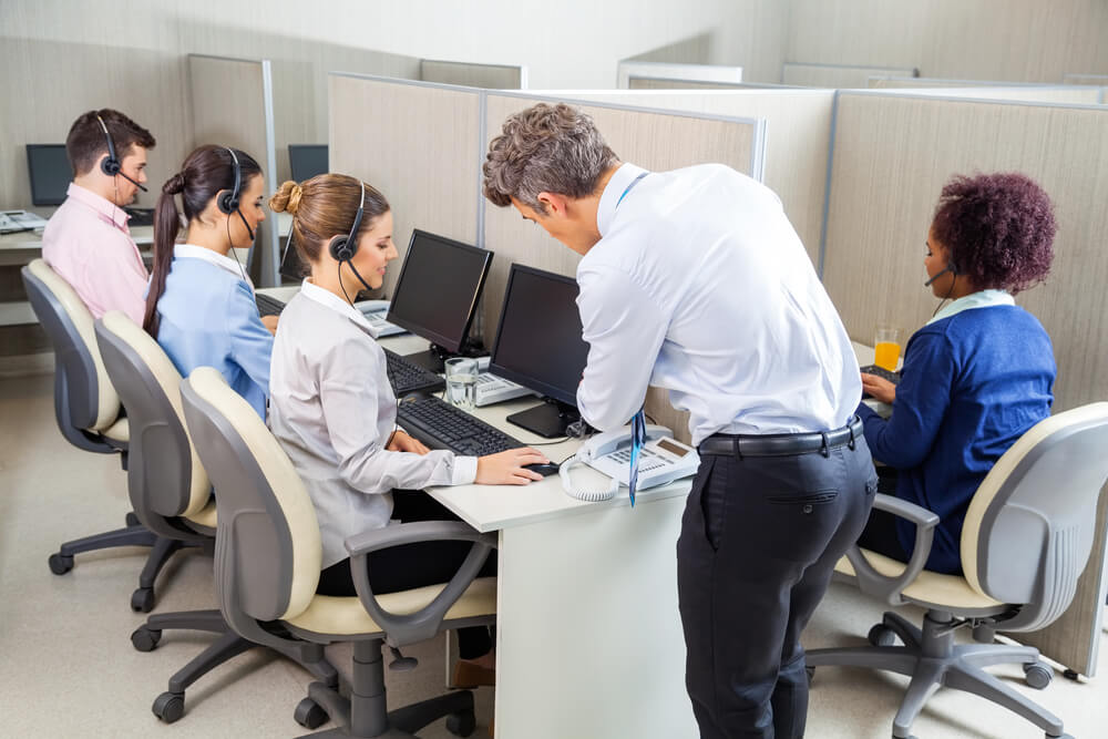 Workers in cubicles in a call center