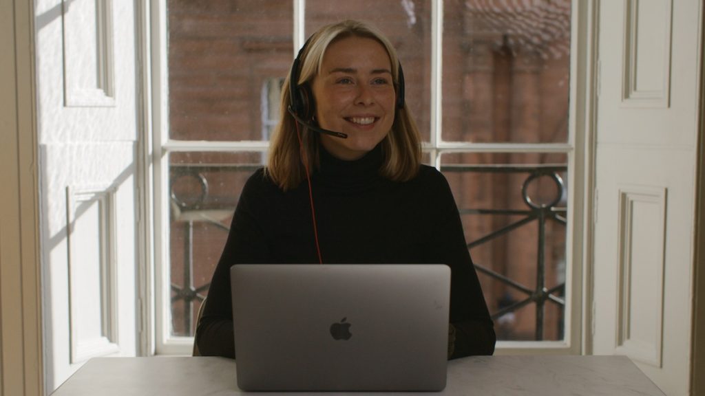 A virtual receptionist with a headset in a home environment