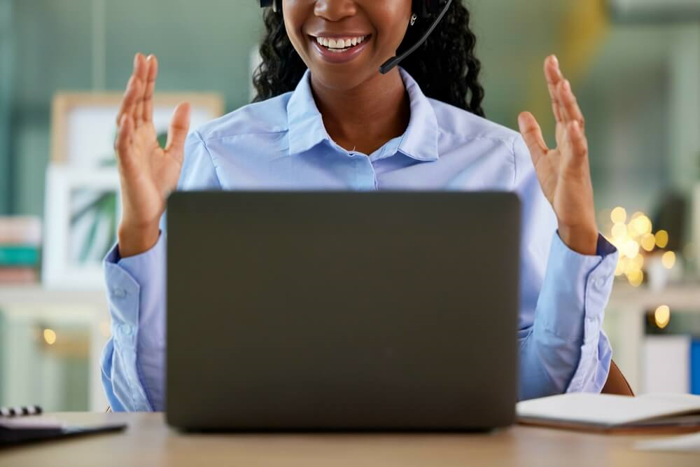 Smiling woman at her laptop