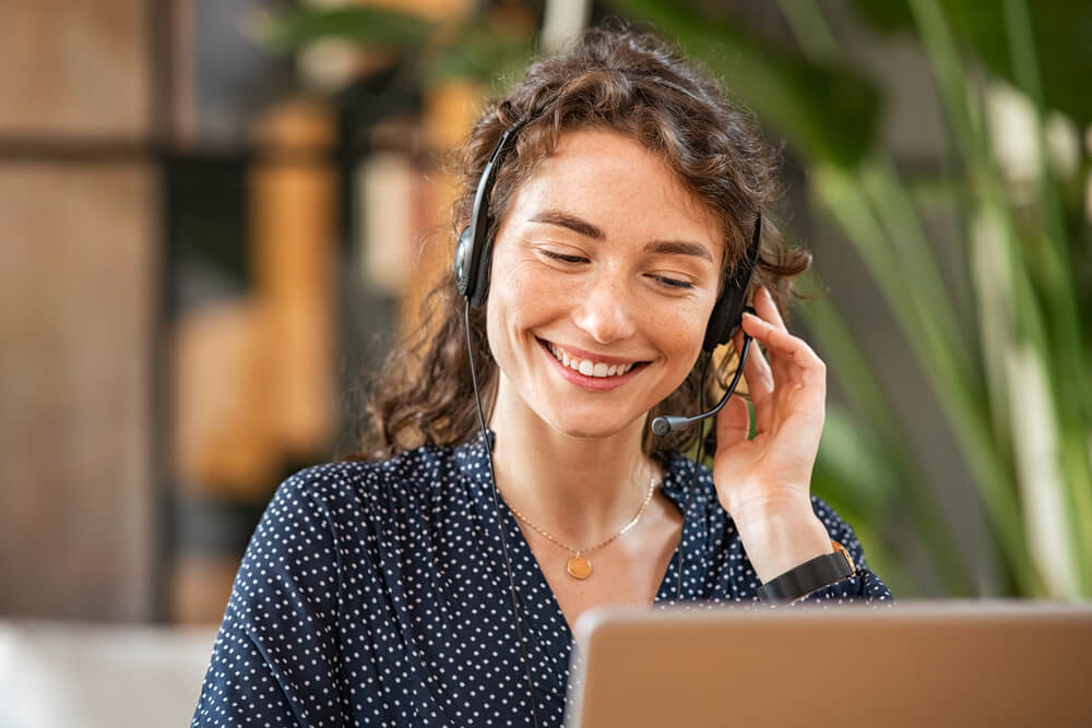 Receptionist giving customer service through a headset