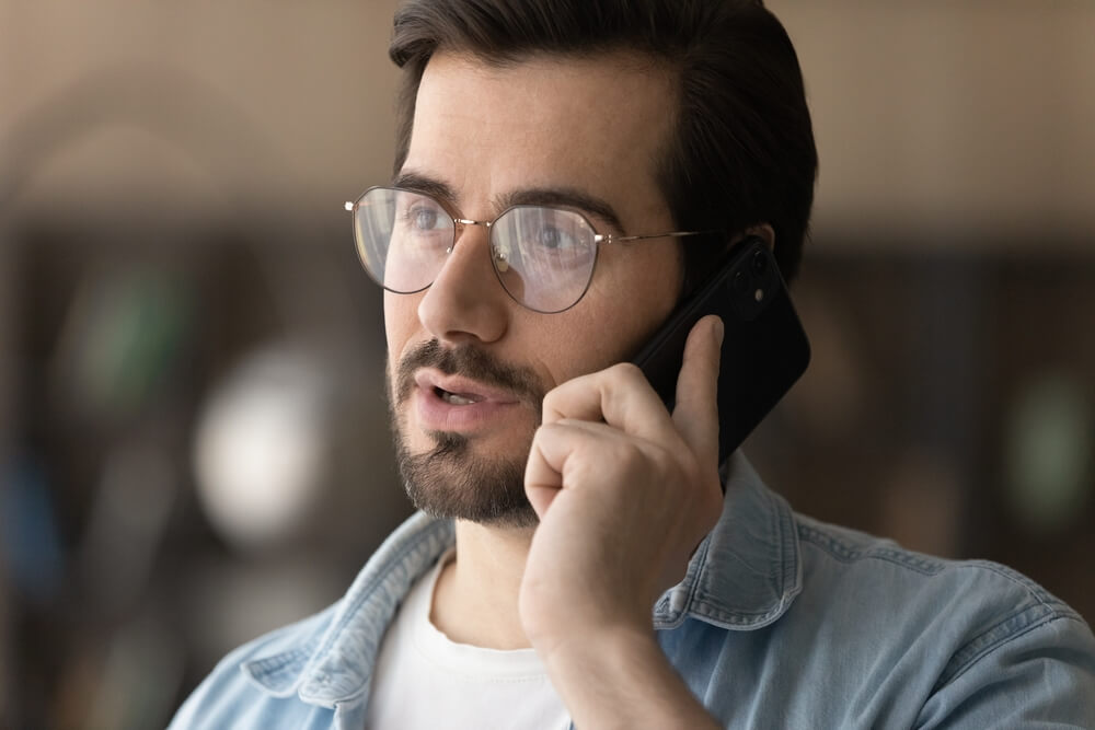 An image of a person receiving a call on their mobile phone