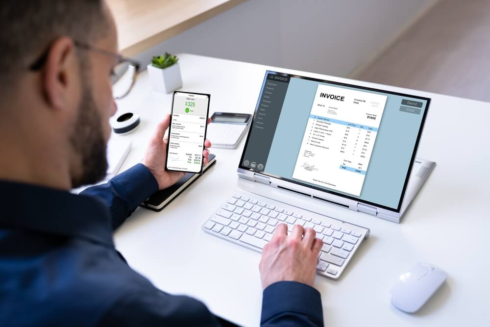 Phone and computer on the table showing order management