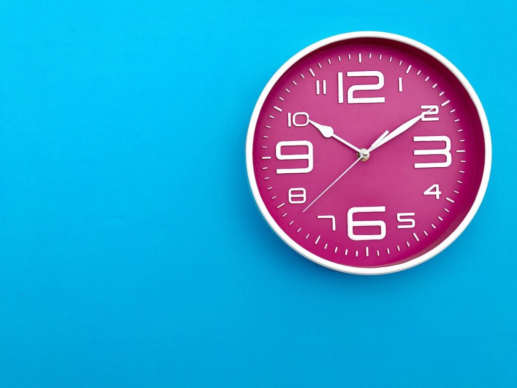 A pink wall clock