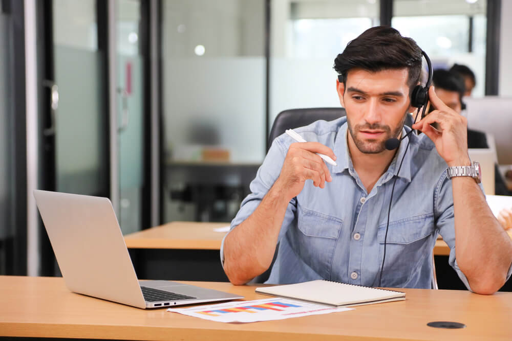 Man answering a customer's phone call 