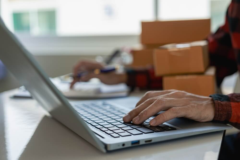 Businessman packing things and preparing to send. 