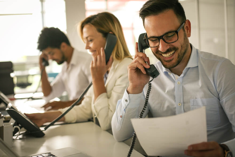 Customer representatives talking on the landline.jpg