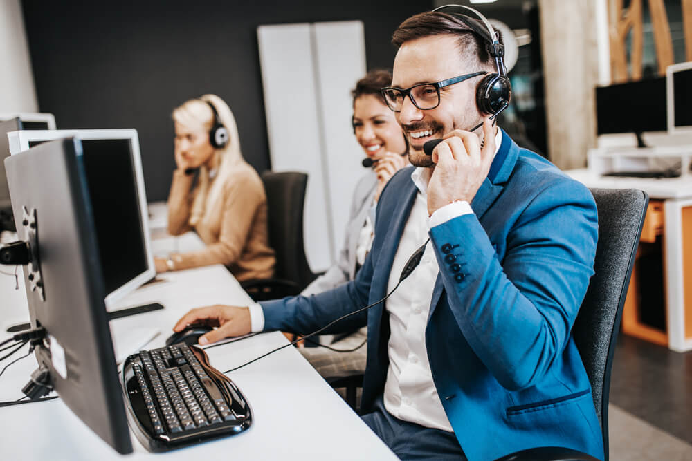 Male customer service agent with a headset