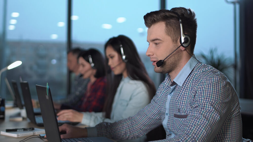 Man with a headset talking on the phone