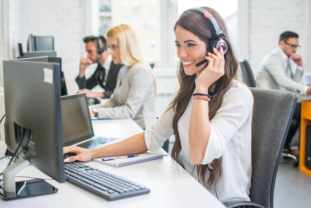 smiling virtual receptionist talking to a customer