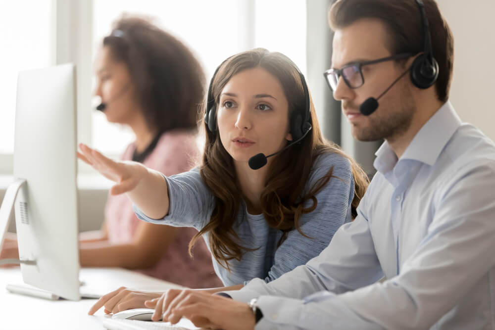 call center employees wearing headsets 