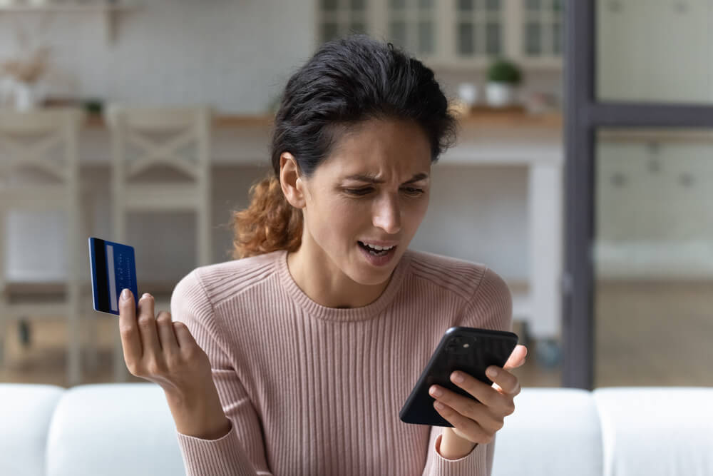 angry women looking in her phone screen 