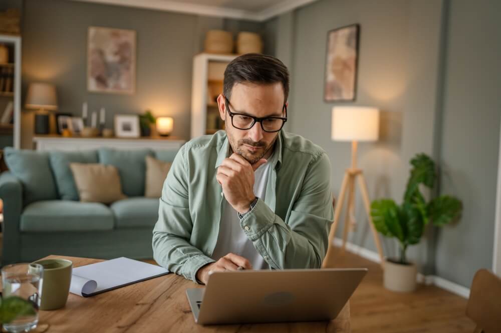 man looking in his laptop