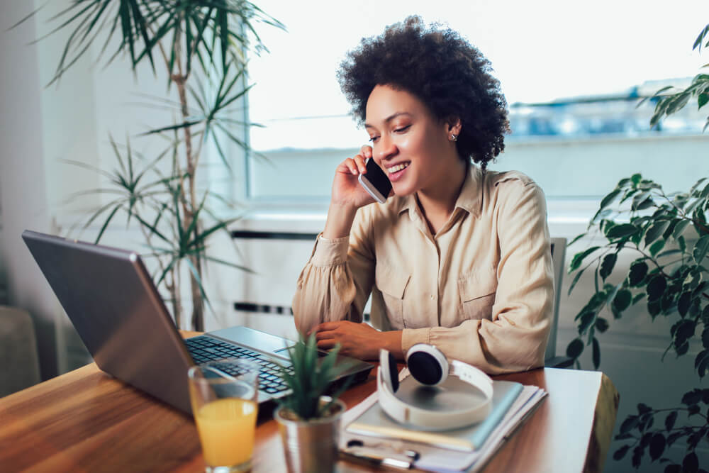 women speaking to someone in call