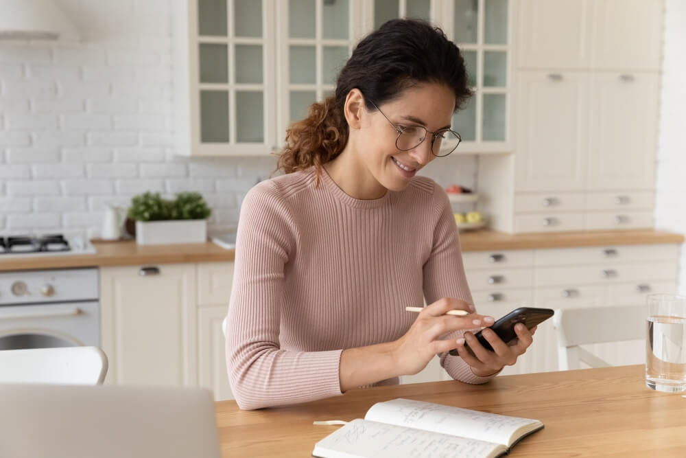 women watching her phone