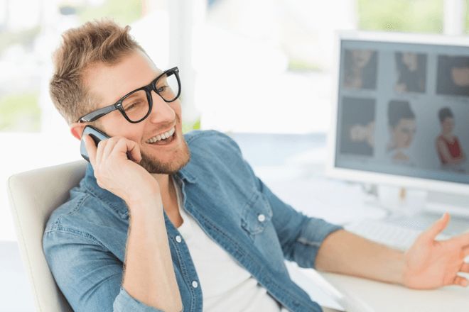 Man talking on a mobile, using call handling skills to help customers