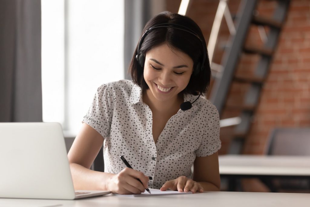 Smiling woman on call providing SME sales & support