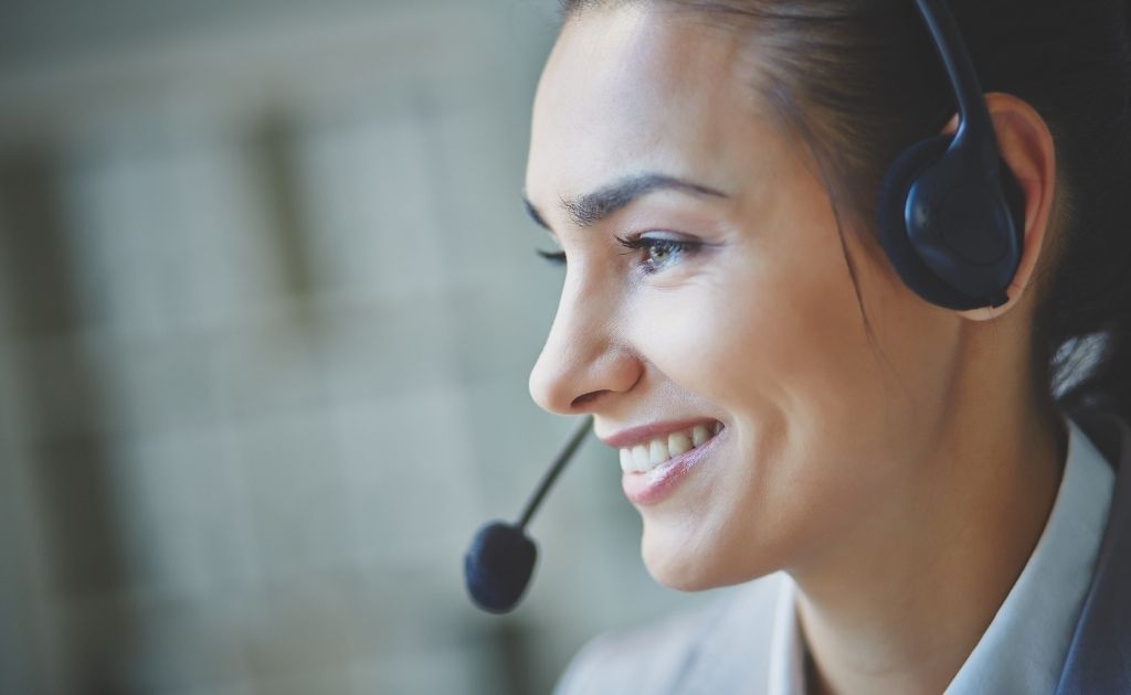 Woman answering calls using a headset for inbound call centre services