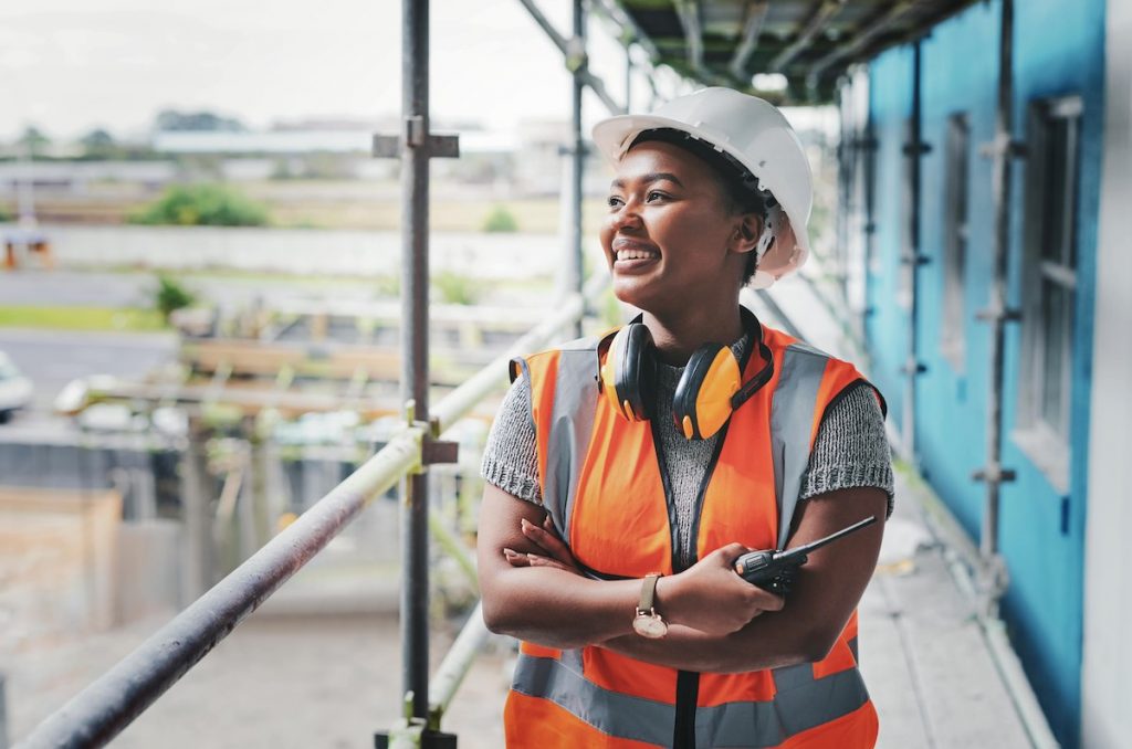 Smiling site manager on building site