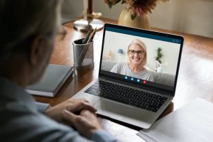 Woman in video meeting with colleague