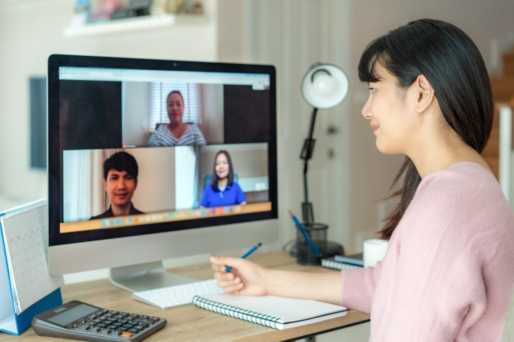 Woman on call with team in series of video meetings