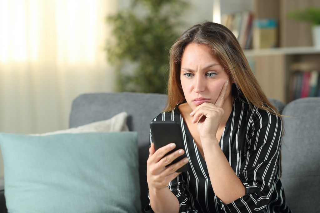 Woman calling letting agents talking to facilities management answering service