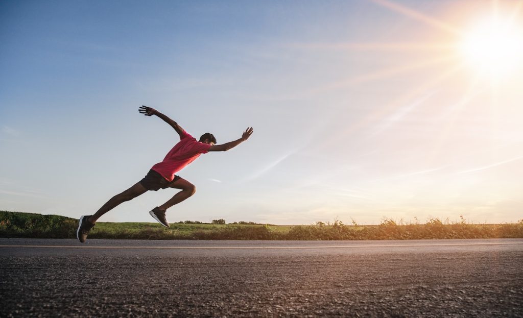 Athlete runner feet running on road