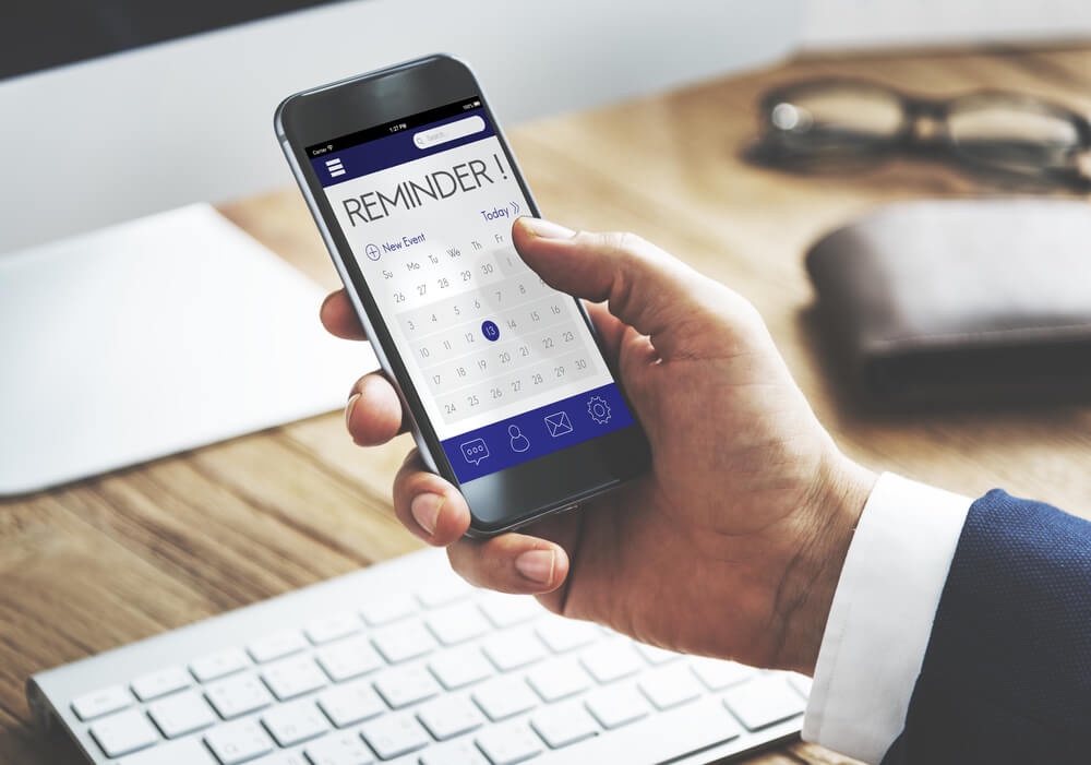 Appointment reminder from appointment scheduling software on smartphone