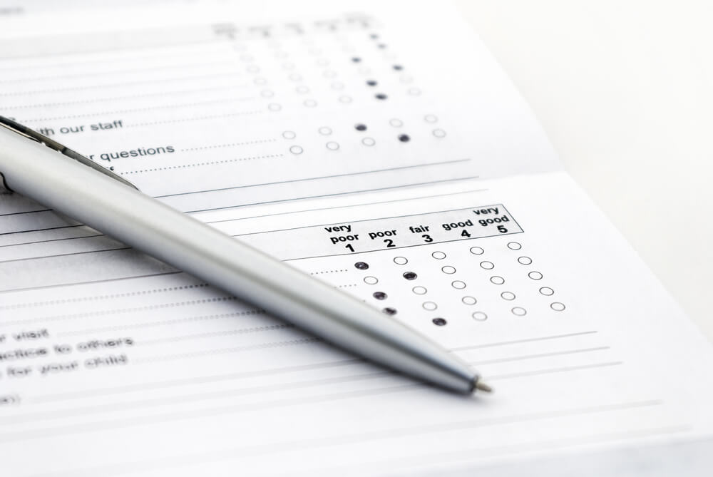 Employee satisfaction survey on table with pen