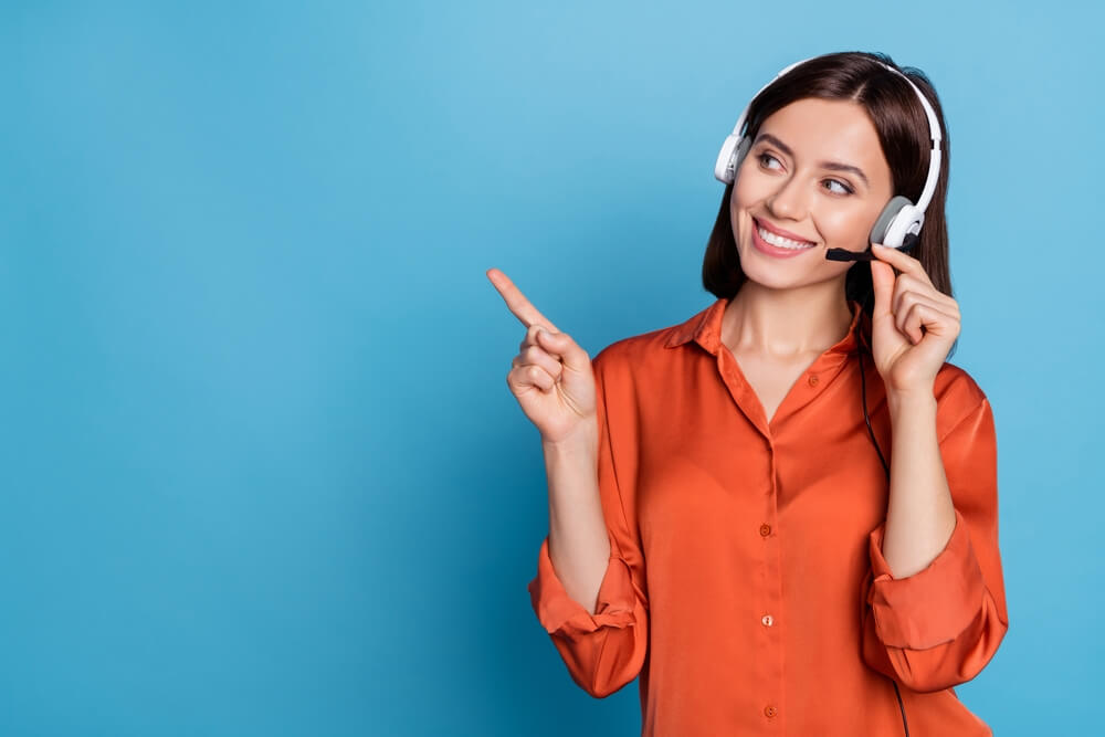 Smiling receptionist working as Outsourced Customer Service agent

