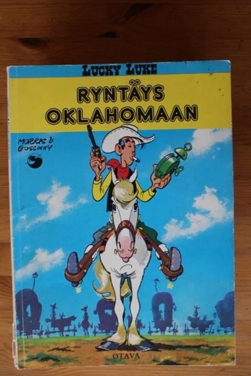 Lucky Luke - Ryntäys Oklahomaan | Antikvaarinen Kirjakauppa Tessi | Osta Antikvaarista - Kirjakauppa verkossa