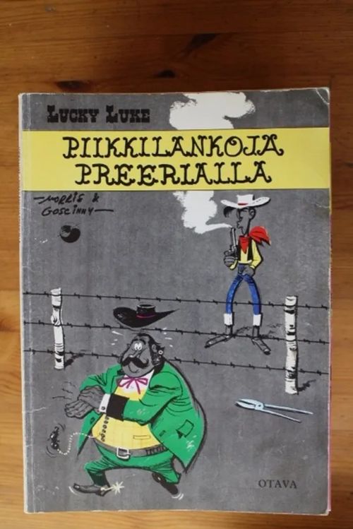 Lucky Luke - Piikkilankoja preerialla | Antikvaarinen Kirjakauppa Tessi | Osta Antikvaarista - Kirjakauppa verkossa