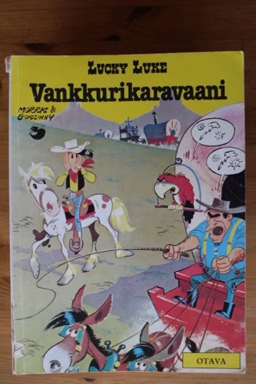 Lucky Luke - Vankkurikaravaani | Antikvaarinen Kirjakauppa Tessi | Osta Antikvaarista - Kirjakauppa verkossa