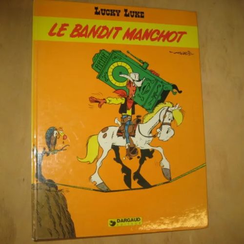 Lucky Luke - Le bandit manchot - de Groot Bob, Morris | Divari & Antikvariaatti Kummisetä | Osta Antikvaarista - Kirjakauppa verkossa