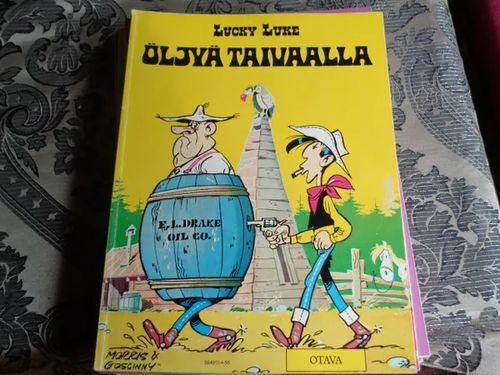 Lucky Luke - Öljyä taivaalla | Tomin antikvariaatti | Osta Antikvaarista - Kirjakauppa verkossa