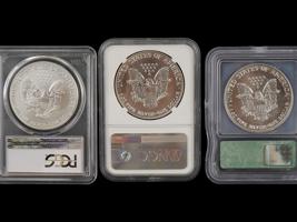 THREE VINTAGE AMERICAN SILVER EAGLE COINS GRADED